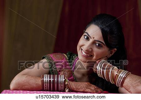 Close-up portrait of smiling young Indian bride View Large Photo Image Stock Photo - Close-up portrait of smiling young Indian bride . Fotosearch