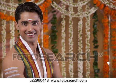 Stock Photo - Close-up portrait of young groom smiling . Fotosearch