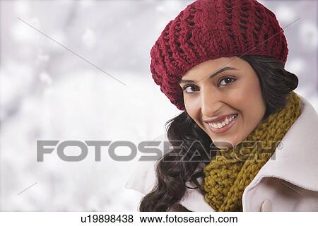Stock Photo - Close-up portrait of young woman in warm clothes . Fotosearch