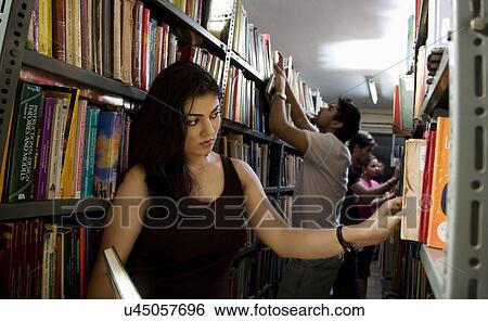 College students in the library View Large Photo Image Stock Photograph - College students in the library . Fotosearch
