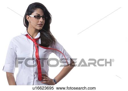 Stock Photography - Confident fashionable businesswoman wearing glasses over white background. Fotosearch