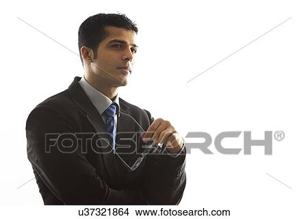 Picture - Confident male executive over white background . Fotosearch