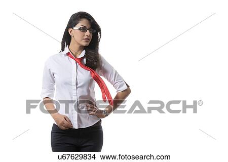 Picture - Confident young fashionable businesswoman over white background. Fotosearch