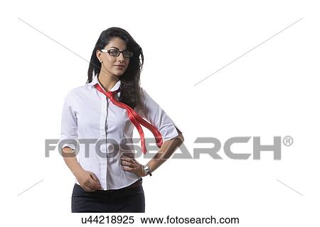 Stock Photography - Confident young fashionable businesswoman smiling over white background. Fotosearch