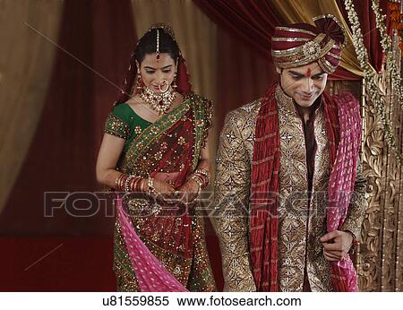 Couple during mangal phera View Large Photo Image Stock Photography - Couple during mangal phera . Fotosearch