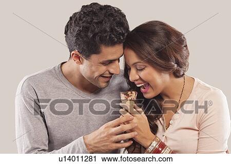Couple eating ice cream View Large Photo Image Stock Image - Couple eating ice cream. Fotosearch