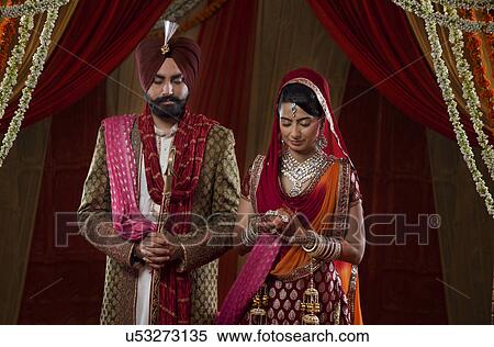 Couple in traditional Indian clothing View Large Photo Image Stock Photography - Couple in traditional Indian clothing . Fotosearch