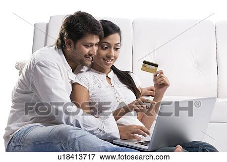 Stock Photo - Couple net banking . Fotosearch