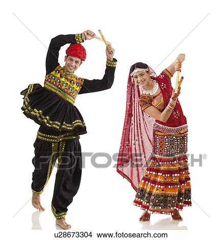 Couple performing dandia dance View Large Photo Image Picture - Couple performing dandia dance . Fotosearch