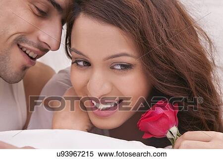 Couple romancing in bed View Large Photo Image Stock Photography - Couple romancing in bed. Fotosearch