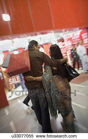 Couple shopping View Large Photo Image Stock Photography - Couple shopping . Fotosearch