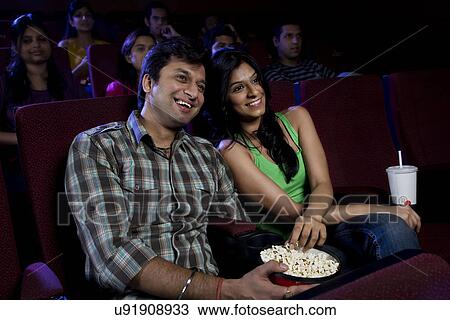 Stock Image - Couple watching a movie . Fotosearch