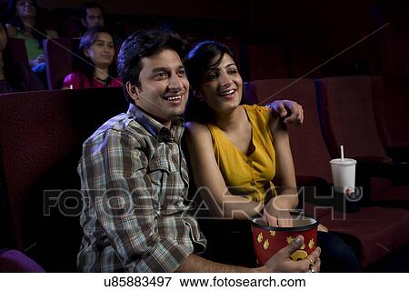Couple watching a movie View Large Photo Image Stock Photo - Couple watching a movie . Fotosearch