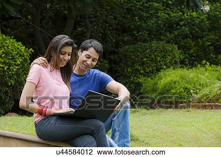 Stock Image - Couple with a laptop . Fotosearch