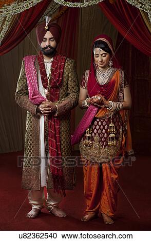 Couple with eyes closed on their wedding day View Large Photo Image Stock Image - Couple with eyes closed on their wedding day . Fotosearch