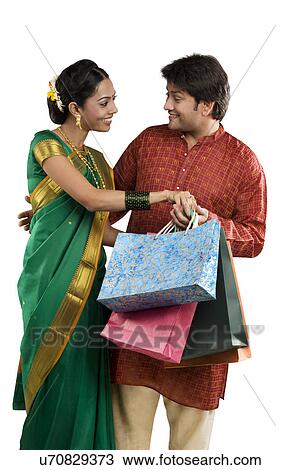Stock Image - Couple with shopping bags . Fotosearch