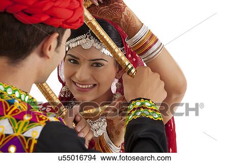 Picture - Couple with sticks dancing . Fotosearch