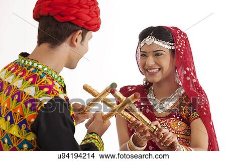 Picture - Couple with sticks dancing . Fotosearch