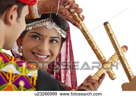 Couple with sticks dancing View Large Photo Image Stock Photo - Couple with sticks dancing . Fotosearch