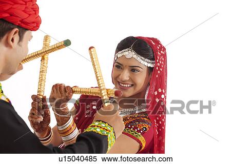 Stock Photography - Couple with sticks dancing . Fotosearch