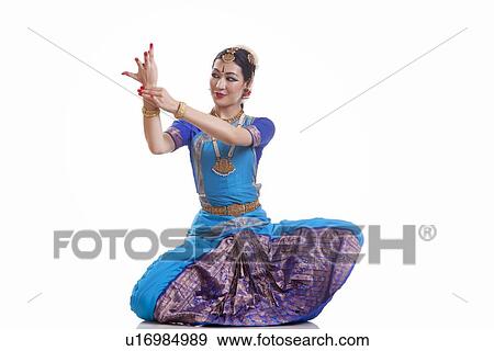 Stock Photo - Dancer performing Bharatanatyam against white background. Fotosearch