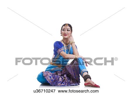 Dancer performing Bharatanatyam over white background View Large Photo Image Stock Photo - Dancer performing Bharatanatyam over white background. Fotosearch