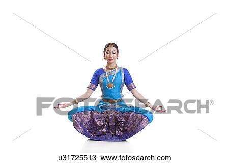 Dancer with eyes closed performing Bharatanatyam against white background View Large Photo Image Stock Image - Dancer with eyes closed performing Bharatanatyam against white background. Fotosearch
