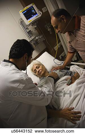 Doctor checking patient's heartbeat View Large Photo Image Stock Image - Doctor checking patient's heartbeat . Fotosearch