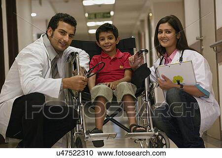 Doctors and a child View Large Photo Image Stock Image - Doctors and a child . Fotosearch