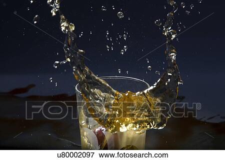 Drink splashing View Large Photo Image Stock Photo - Drink splashing . Fotosearch