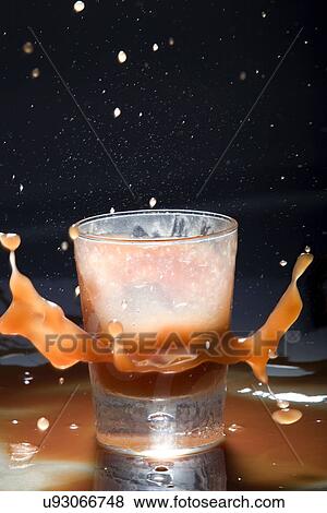 Drink splashing View Large Photo Image Stock Photo - Drink splashing . Fotosearch