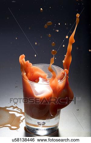 Drink splashing View Large Photo Image Stock Photograph - Drink splashing . Fotosearch