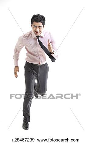 Excited businessman running over white background View Large Photo Image Stock Photo - Excited businessman running over white background . Fotosearch