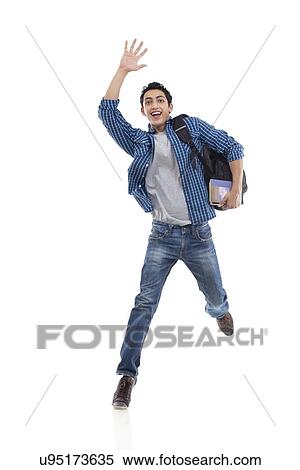 Excited young college student waving over white background View Large Photo Image Stock Photography - Excited young college student waving over white background . Fotosearch
