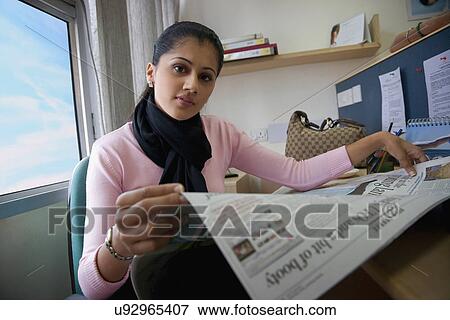 Stock Photo - Executive reading the newspaper . Fotosearch