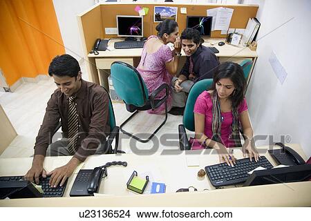 Executive whispering View Large Photo Image Picture - Executive whispering . Fotosearch