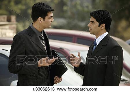 Executives engaging in a discussion View Large Photo Image Stock Image - Executives engaging in a discussion . Fotosearch