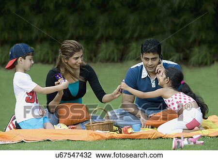 Family at picnic View Large Photo Image Stock Image - Family at picnic . Fotosearch