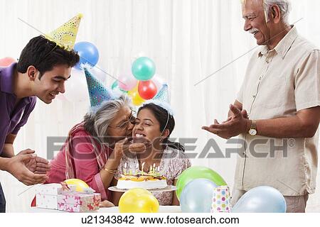 Stock Image - Family celebrating birthday. Fotosearch