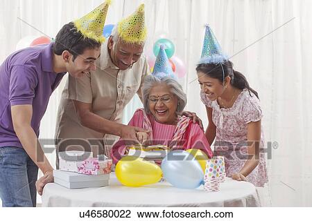 Stock Image - Family celebrating birthday. Fotosearch
