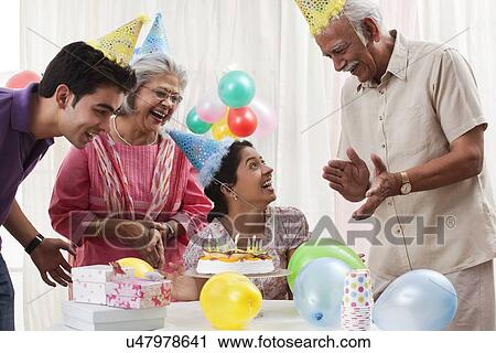 Family celebrating birthday View Large Photo Image Stock Image - Family celebrating birthday. Fotosearch