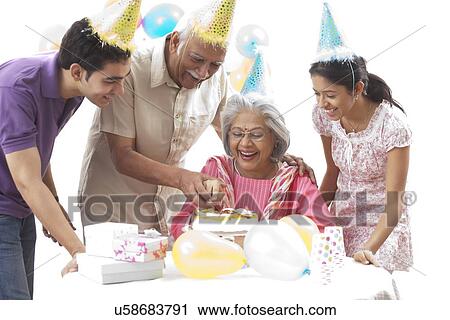 Stock Image - Family celebrating birthday. Fotosearch