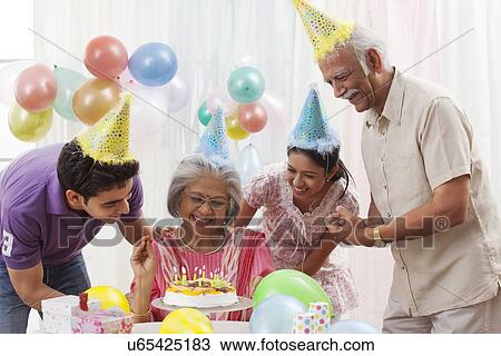 Stock Image - Family celebrating birthday. Fotosearch