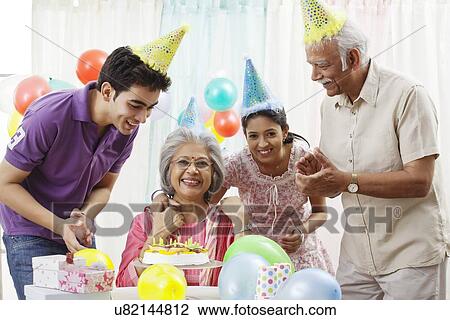 Family celebrating birthday View Large Photo Image Stock Image - Family celebrating birthday. Fotosearch