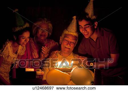 Family celebrating birthday View Large Photo Image Stock Photo - Family celebrating birthday. Fotosearch