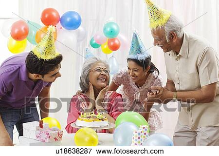 Family celebrating birthday View Large Photo Image Stock Photo - Family celebrating birthday. Fotosearch