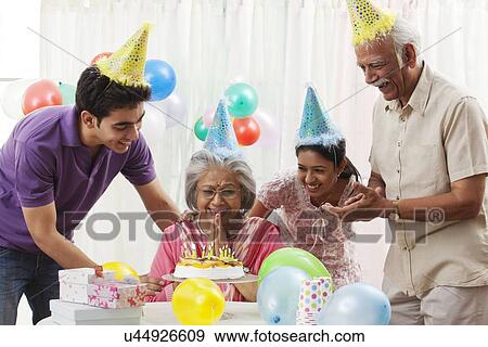 Stock Photo - Family celebrating birthday. Fotosearch