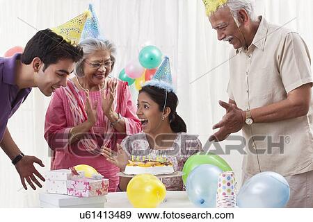 Stock Photo - Family celebrating birthday. Fotosearch