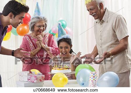 Family celebrating birthday View Large Photo Image Stock Photo - Family celebrating birthday. Fotosearch