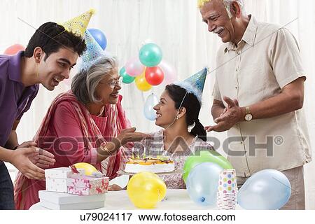 Family celebrating birthday View Large Photo Image Stock Photo - Family celebrating birthday. Fotosearch